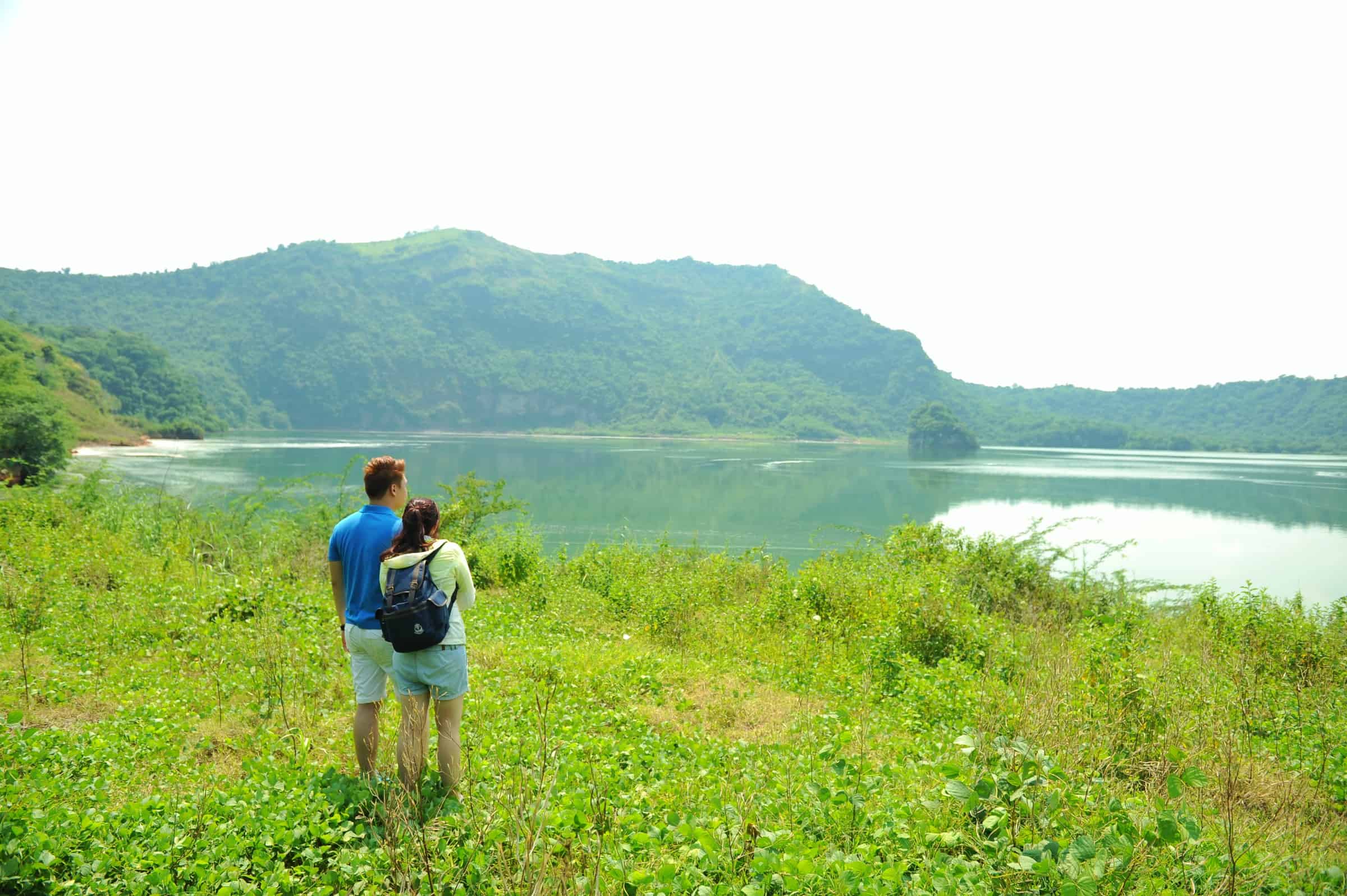 A couple admires Taal Lake together.