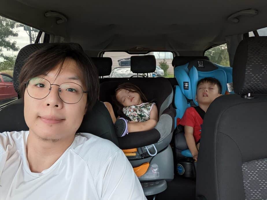 Jed Chan with sleeping kids inside the car.
