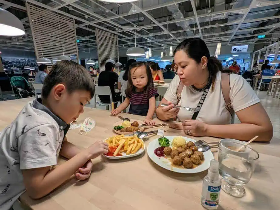 Family eating IKEA Swedish meatballs.