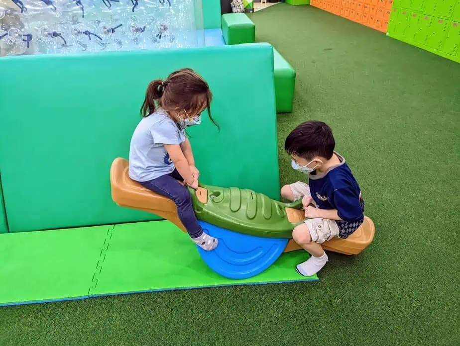 kids playing the seesaw