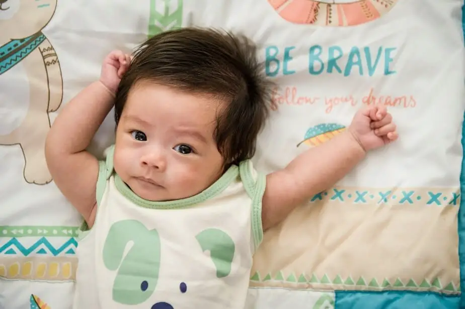 Baby boy with green dog shirt.