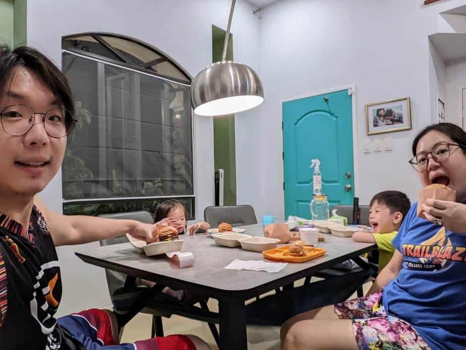 Family having hamburger for dinner.