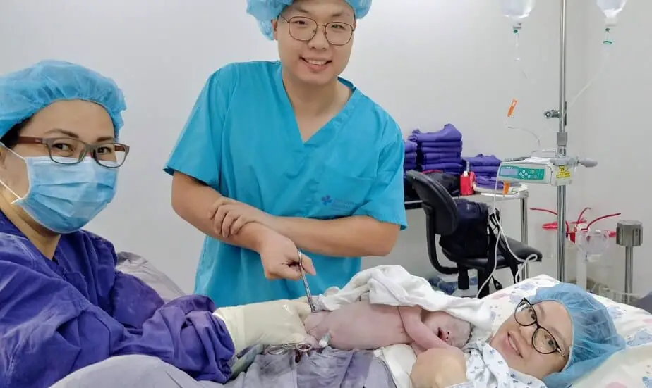 Cutting the baby's umbilical cord.