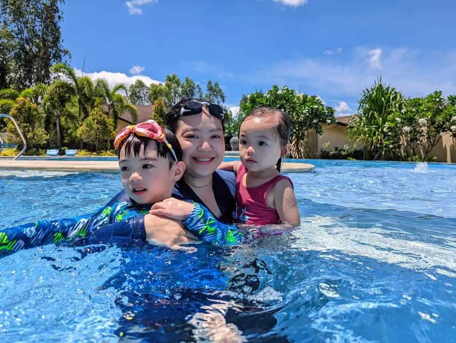 Mom, son, and daughter in a pool.