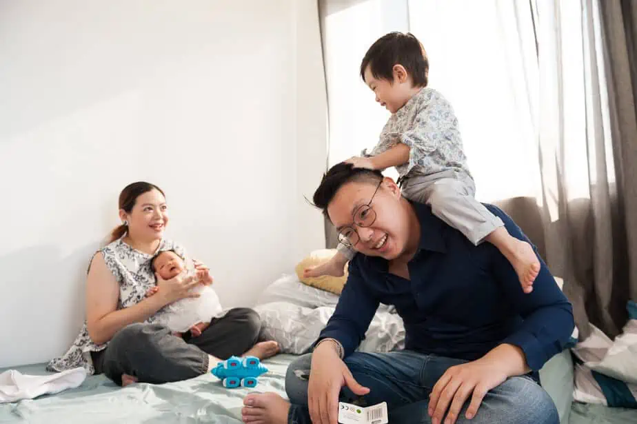 Dad playing with family.