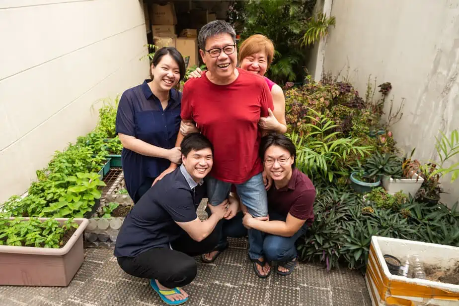 Happy family in mini garden.