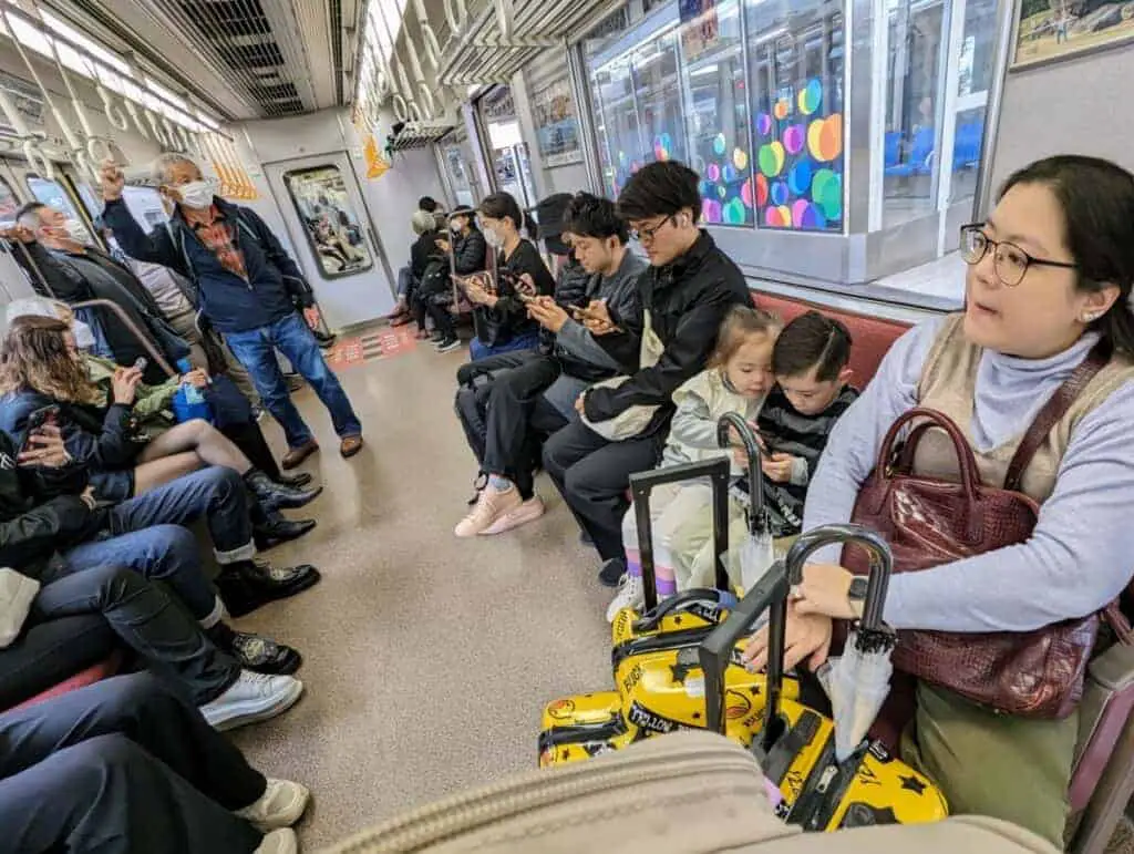 A picture of people on a train in Japan.
